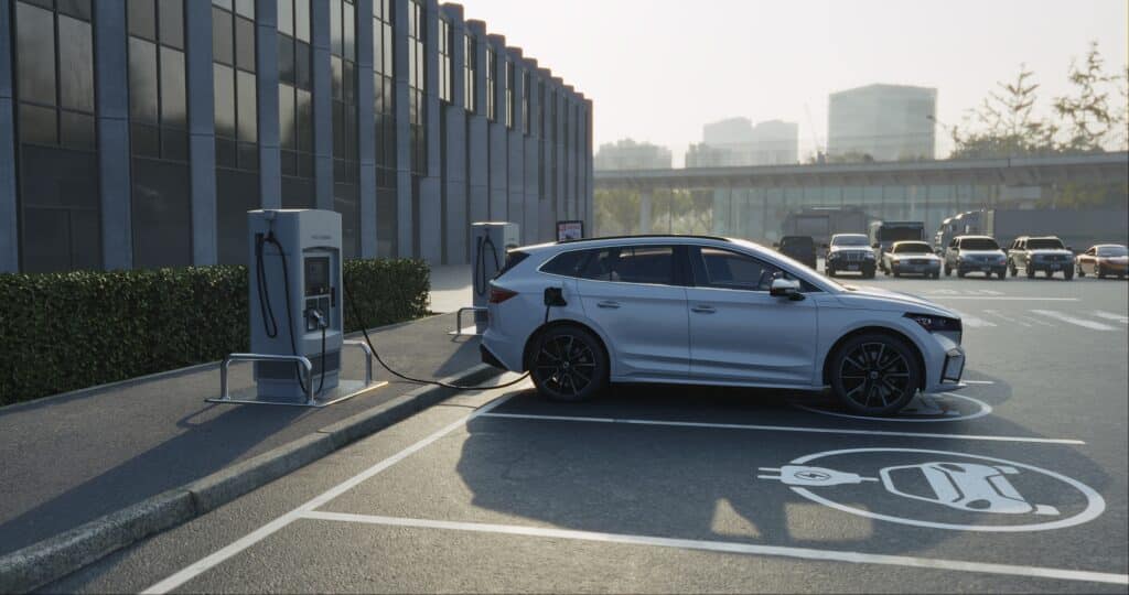 Electric car charging at a public charging station, Shutterstock ID#2454822329